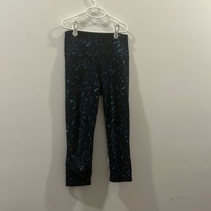 Blue and black kids capri leggings. Slightly worn knees.